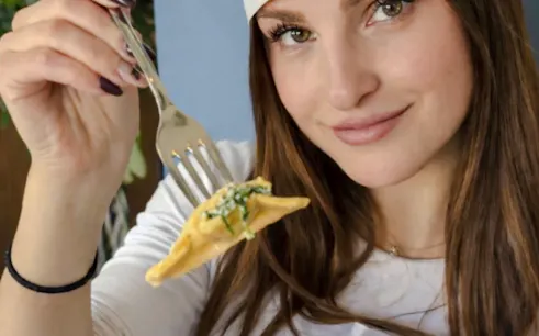 Person holding fork with pasta during Florence pasta class.