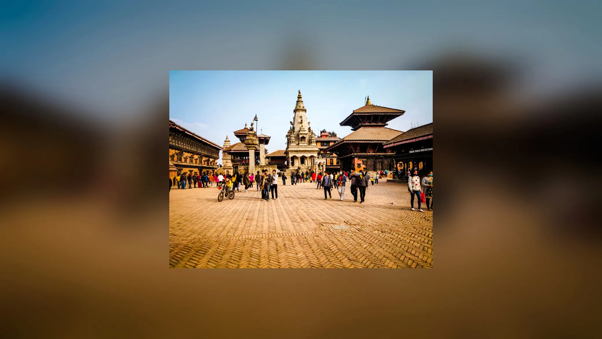 Bhaktapur Durbar Square with tourists exploring historic temples, Kathmandu Valley, Nepal.