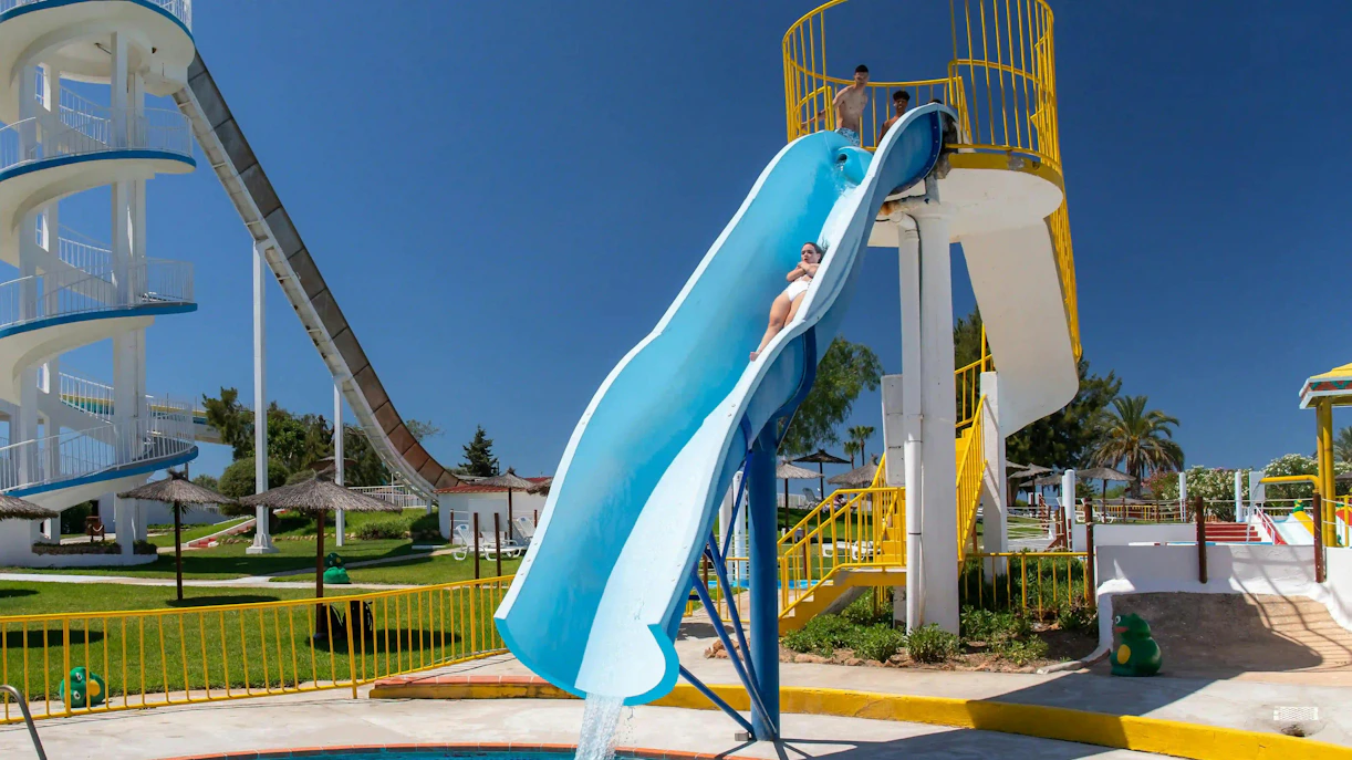 Visitors sliding down Crazy Leap at Aqualand Algarve water park.