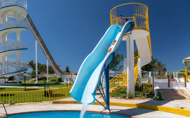 Visitors sliding down Crazy Leap at Aqualand Algarve water park.