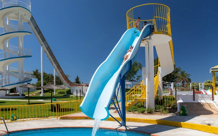 Visitors sliding down Crazy Leap at Aqualand Algarve water park.