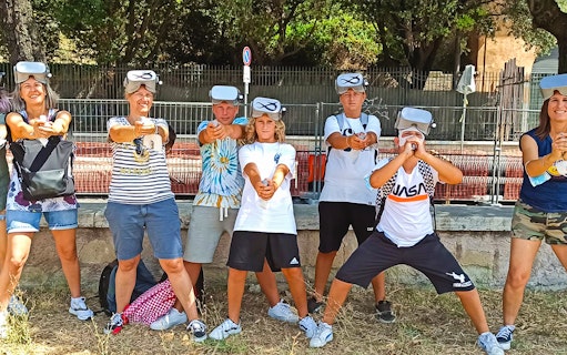 Visitors wearing VR headsets at Circus Maximus virtual reality game in Rome.