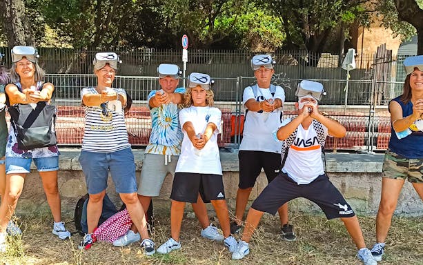 Visitors wearing VR headsets at Circus Maximus virtual reality game in Rome.