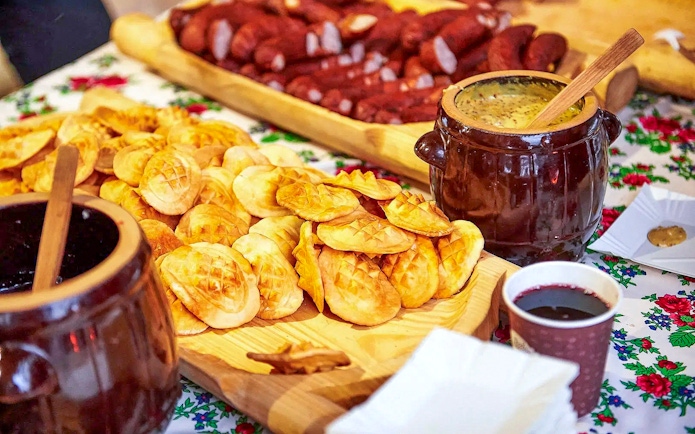 Oscypek cheese with cranberry sauce on a table during Zakopane quad biking adventure.