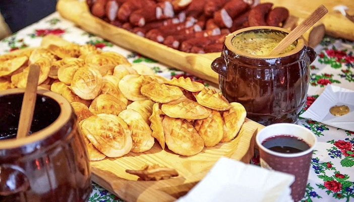 Oscypek cheese with cranberry sauce on a table during Zakopane quad biking adventure.