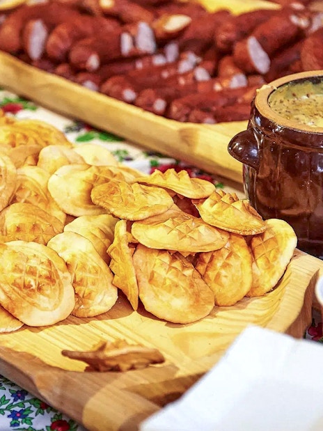 Oscypek cheese with cranberry sauce on a table during Zakopane quad biking adventure.