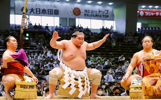 Sumo wrestlers performing ritual at Kyushu Fukuoka Prefecture 2023 Grand Sumo November event.