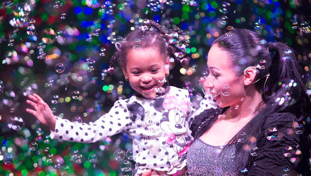 Child enjoying bubbles at The Gazillion Bubble Show.