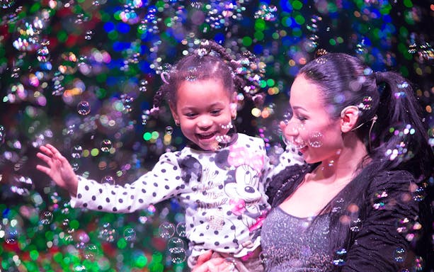 Child enjoying bubbles at The Gazillion Bubble Show.