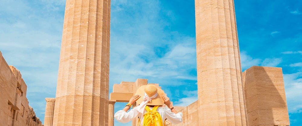 Gondolas on a canal in Venice City with historic buildings in the background.