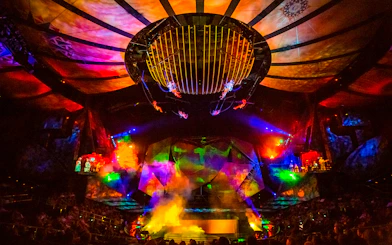 Acrobats performing under colorful lights at Mystère show in Las Vegas.
