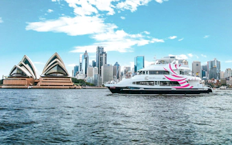 Cruise ship "The Spirit of Migloo" on Sydney Harbour with Sydney Opera House in view.