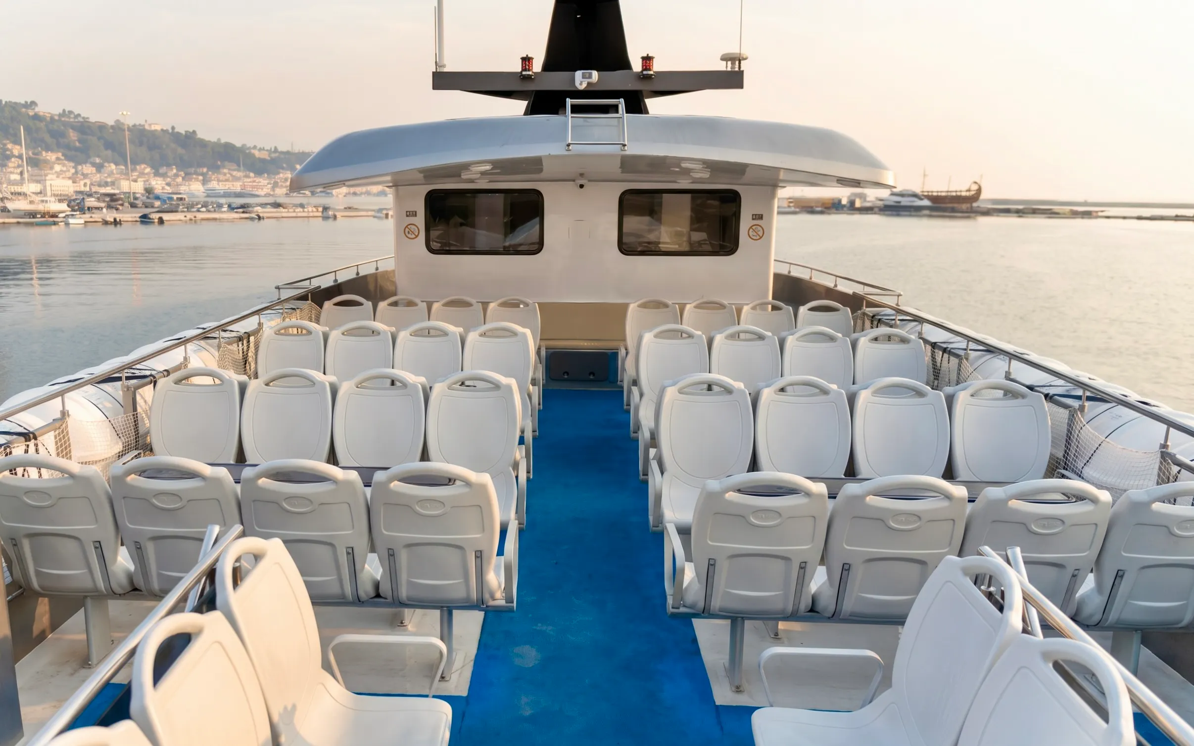 Top deck seating on a cruise ship departing Rhodes for Symi Island and St. George Bay.