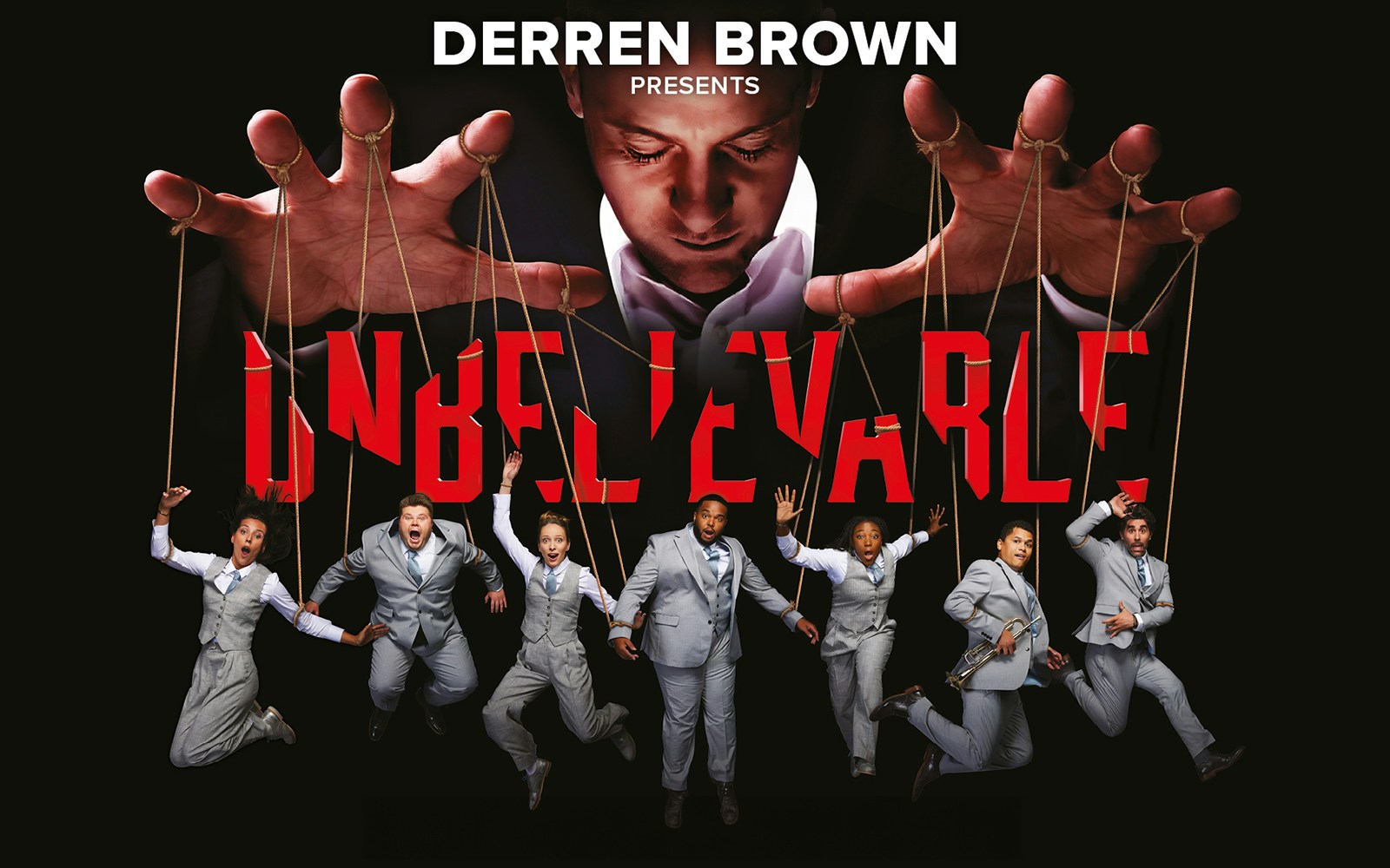 Illusionist controlling performers with strings in "Unbelievable" show.