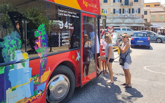 People boarding City Sightseeing hop on hop off tour bus in Corfu.