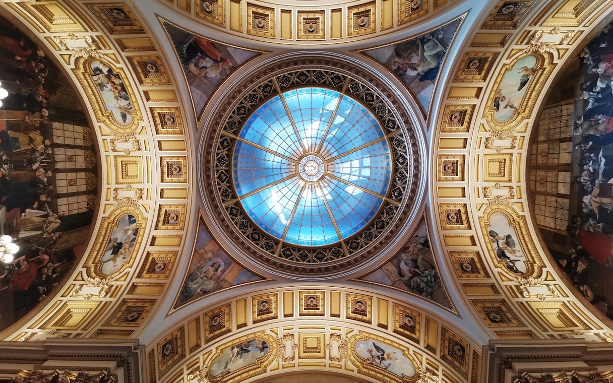 Ceiling dome with intricate frescoes at the National Prague Museum.