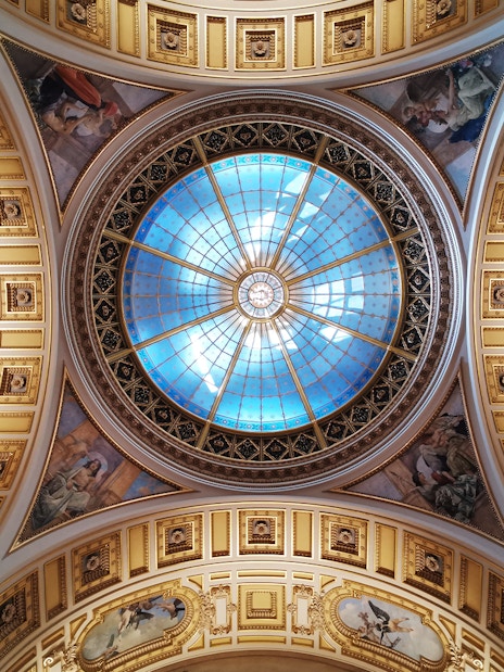 Ceiling dome with intricate frescoes at the National Prague Museum.