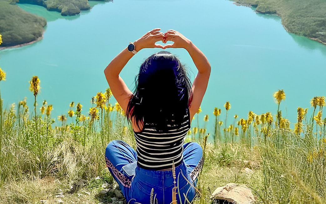 Guest enjoying panoramic view of Bovilla Lake on 4x4 Offroad Tour from Tirana.