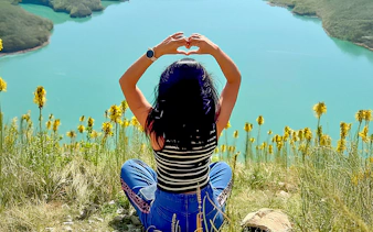 Guest enjoying panoramic view of Bovilla Lake on 4x4 Offroad Tour from Tirana.