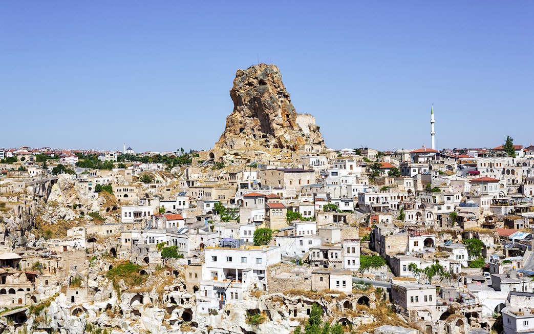 Cappadocia rock formations and traditional stone houses in Ortahisar, Turkey.