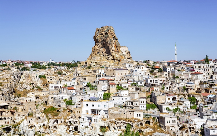 Cappadocia rock formations and traditional stone houses in Ortahisar, Turkey.