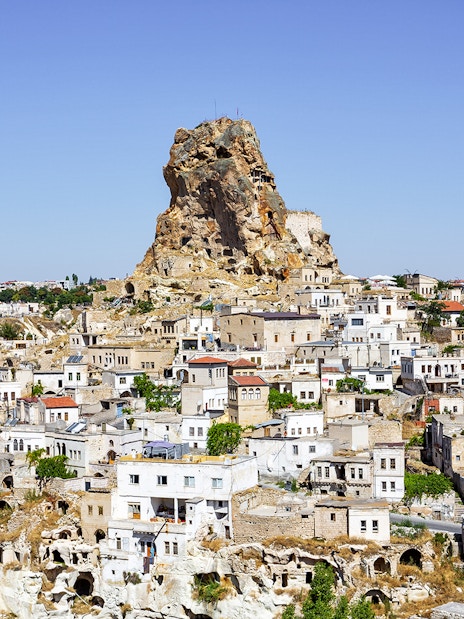 Cappadocia rock formations and traditional stone houses in Ortahisar, Turkey.