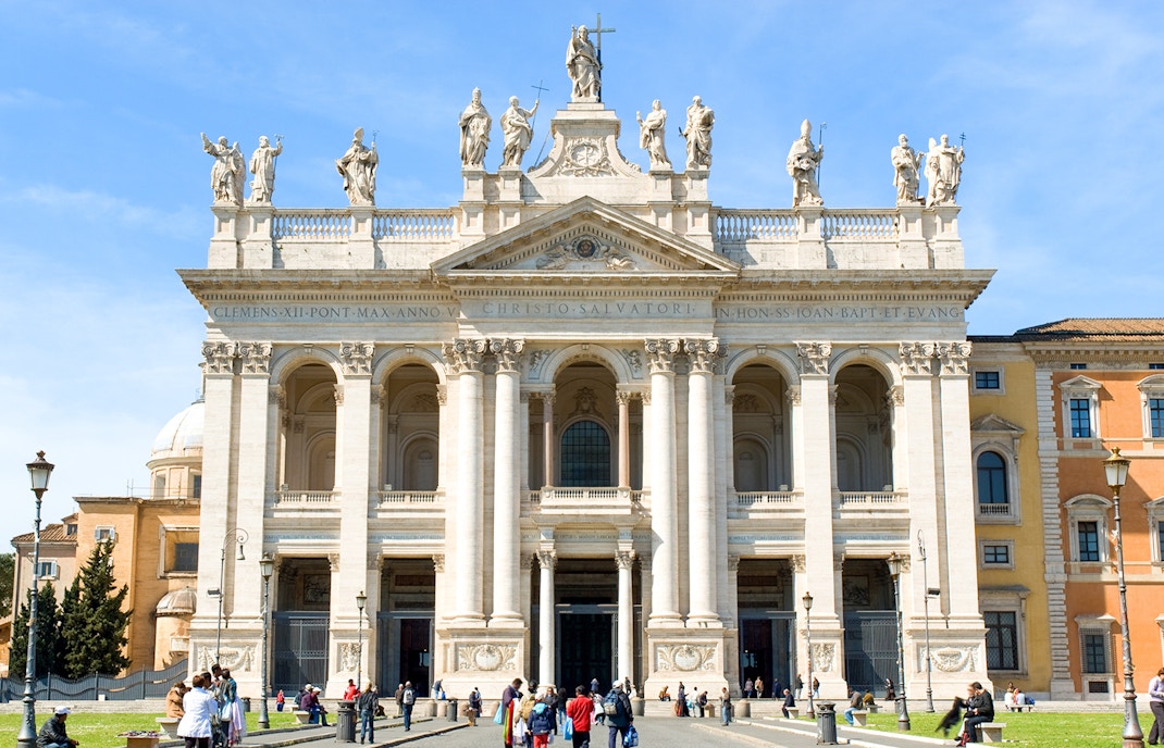 San Giovanni Laterano facade with intricate sculptures and columns in Rome, Italy.