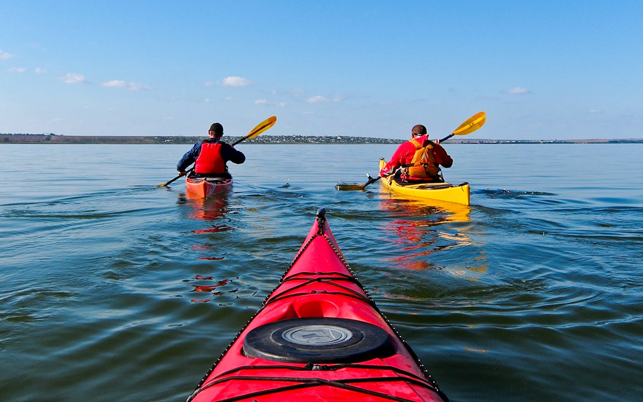 Kayakers paddling in Ieranto Bay during a 4-hour tour.