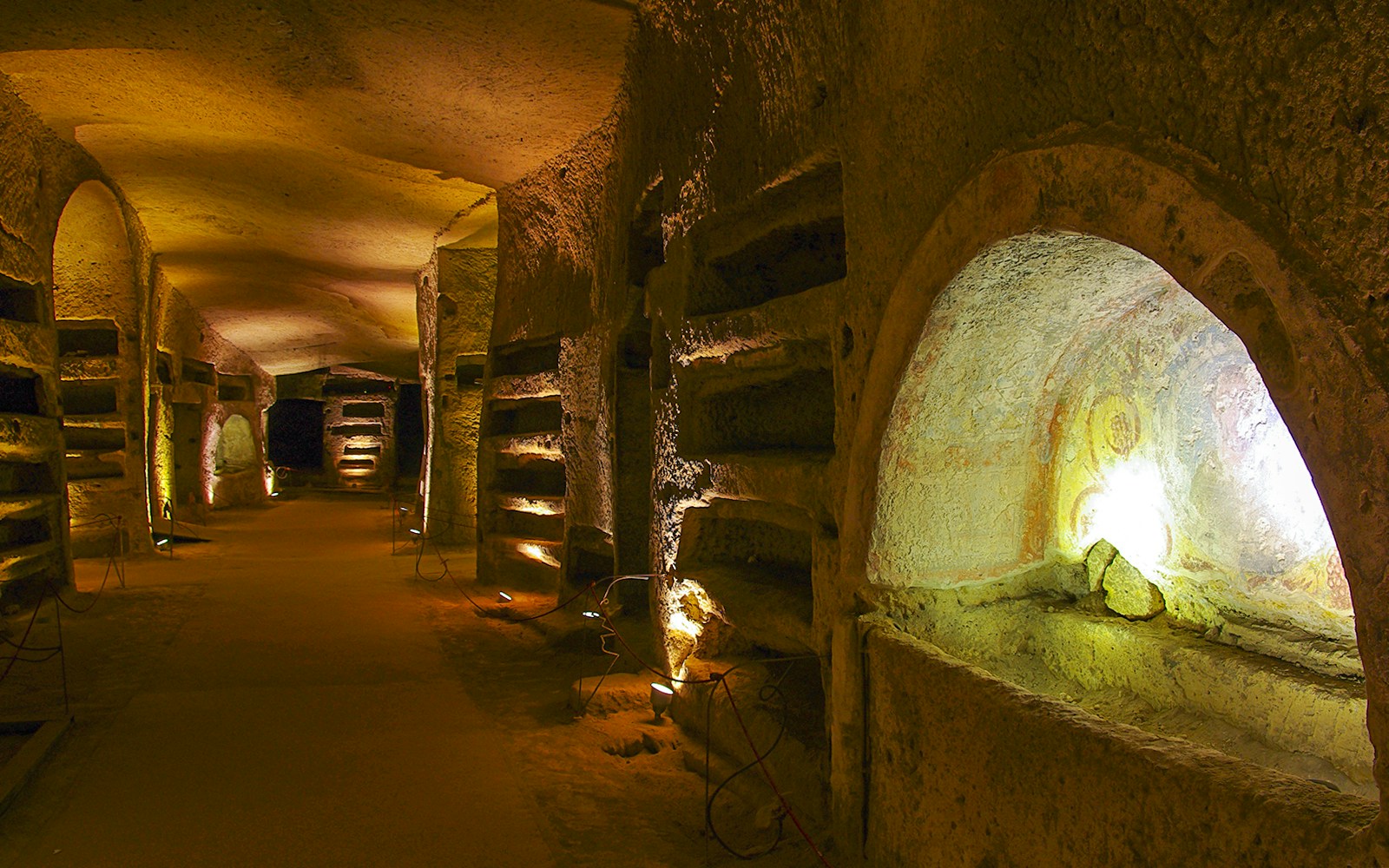 Ancient underground bascillia for prayers, with carved out stones.