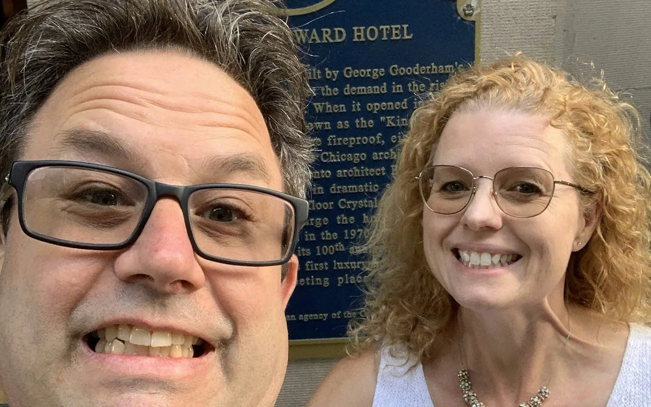 Old Town Toronto exploration game participants in front of historic plaque.