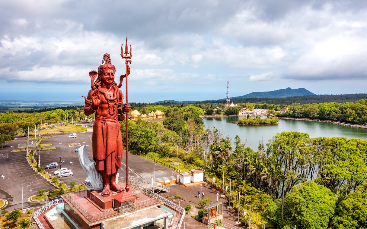 Shiva statue at Ganga Talao, Mauritius, overlooking Grand Bassin lake.