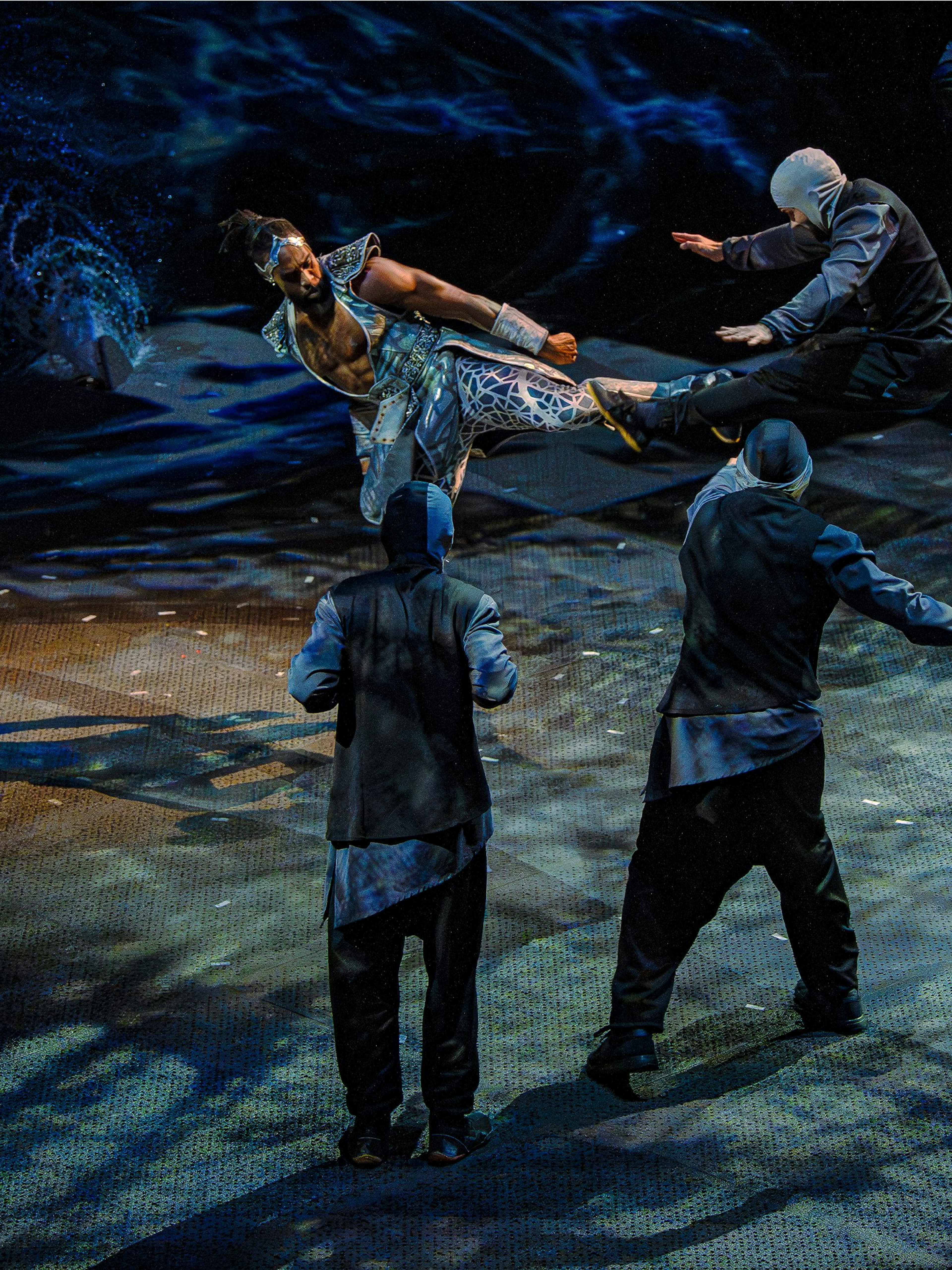 Performer executing a high kick during La Perle show, Dubai.