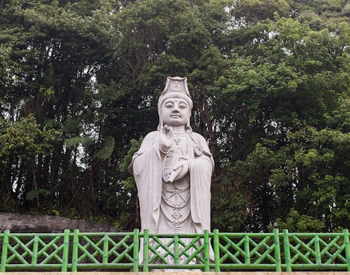 Chin Swee Caves Temple pagoda surrounded by lush greenery in Genting Highlands, Malaysia.