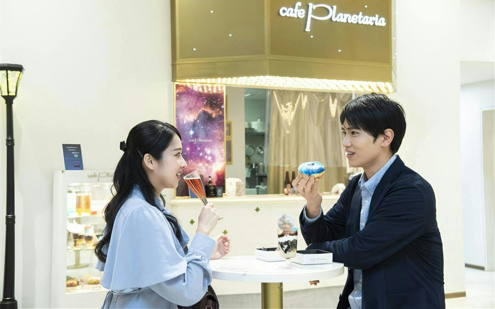 Visitors enjoying desserts at Cafe Planetaria inside Konica Minolta Planetaria TOKYO Ginza.