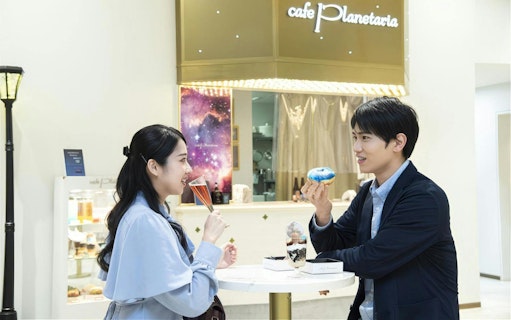 Visitors enjoying desserts at Cafe Planetaria inside Konica Minolta Planetaria TOKYO Ginza.