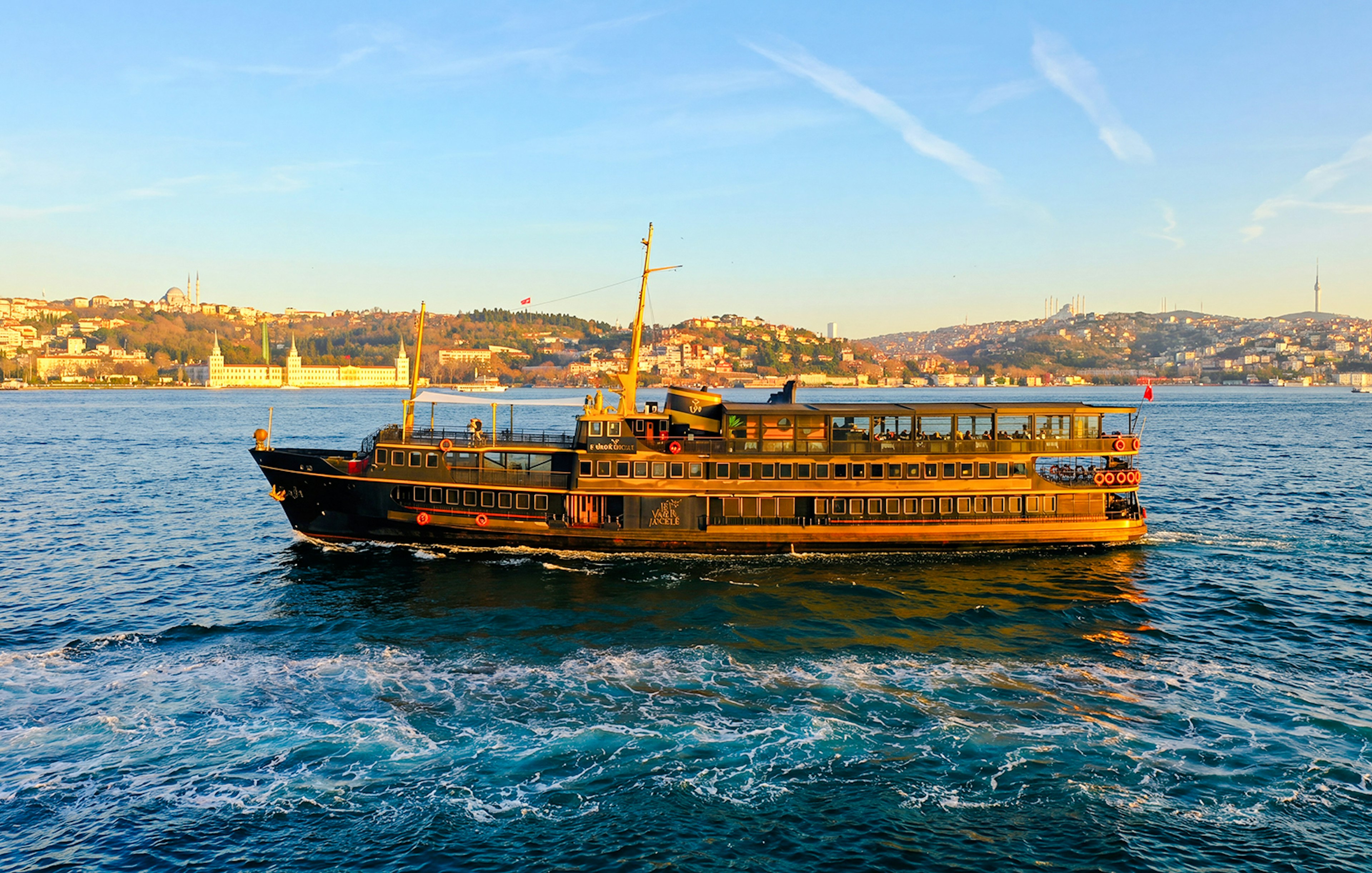 Le Vapeur Magique cruising on the Bosphorus with Istanbul skyline in the background.