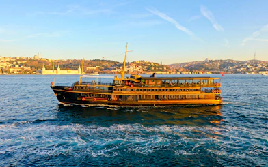 Le Vapeur Magique cruising on the Bosphorus with Istanbul skyline in the background.