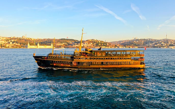 Le Vapeur Magique cruising on the Bosphorus with Istanbul skyline in the background.