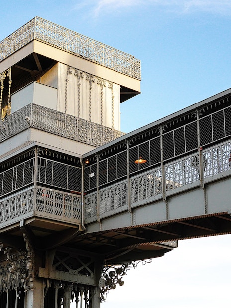 Santa Justa Lift in Lisbon, Portugal, with intricate ironwork against a blue sky.