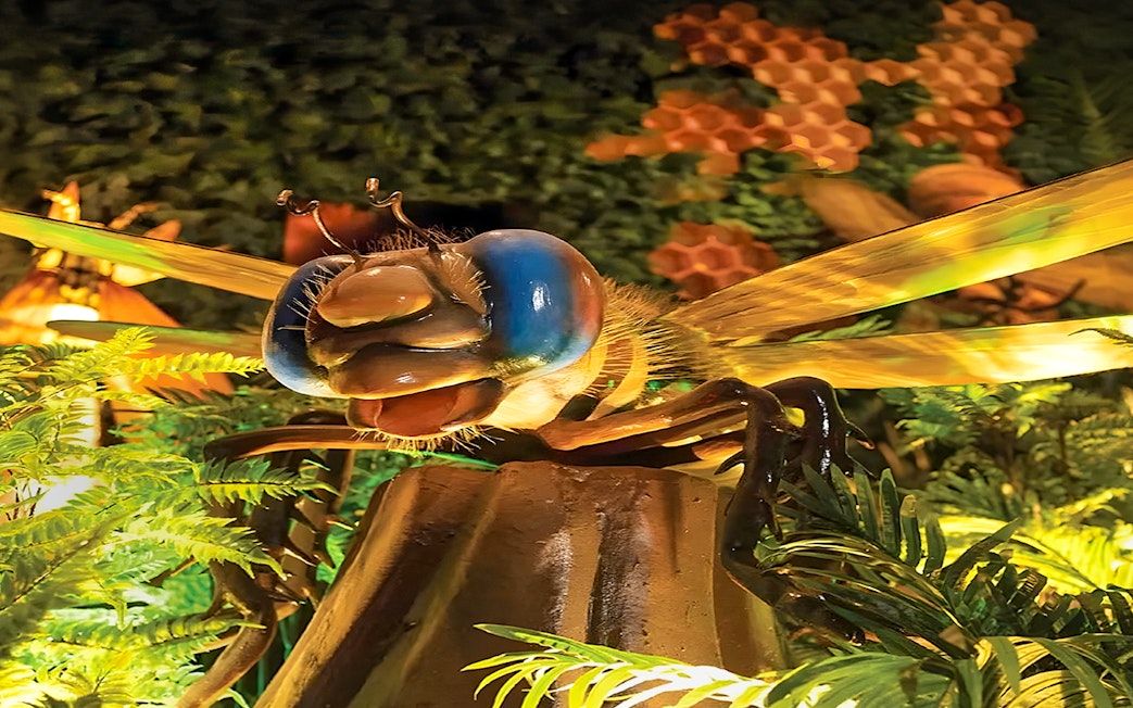 Giant insect sculpture surrounded by foliage at Wetland Studios Putrajaya, Malaysia.