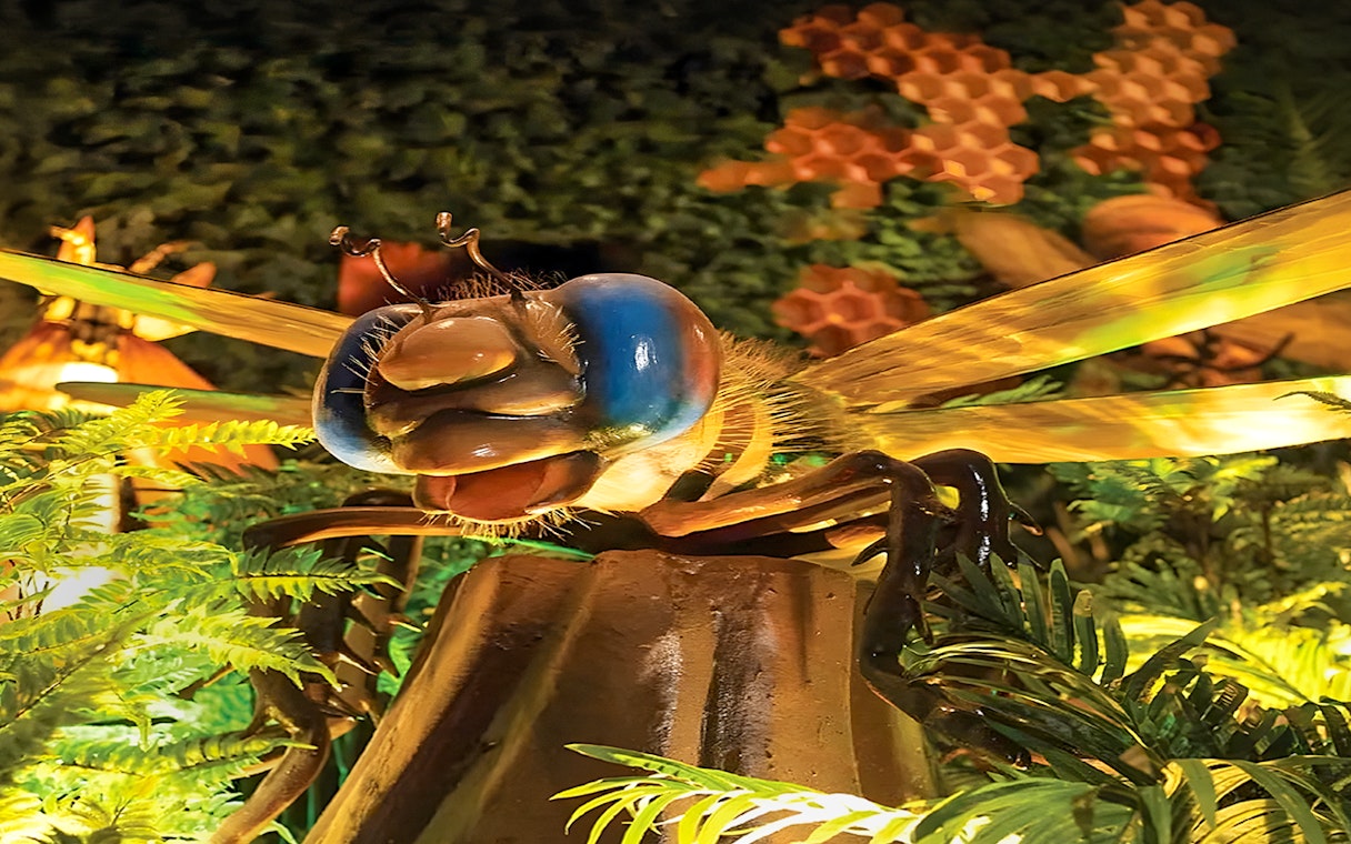 Giant insect sculpture surrounded by foliage at Wetland Studios Putrajaya, Malaysia.