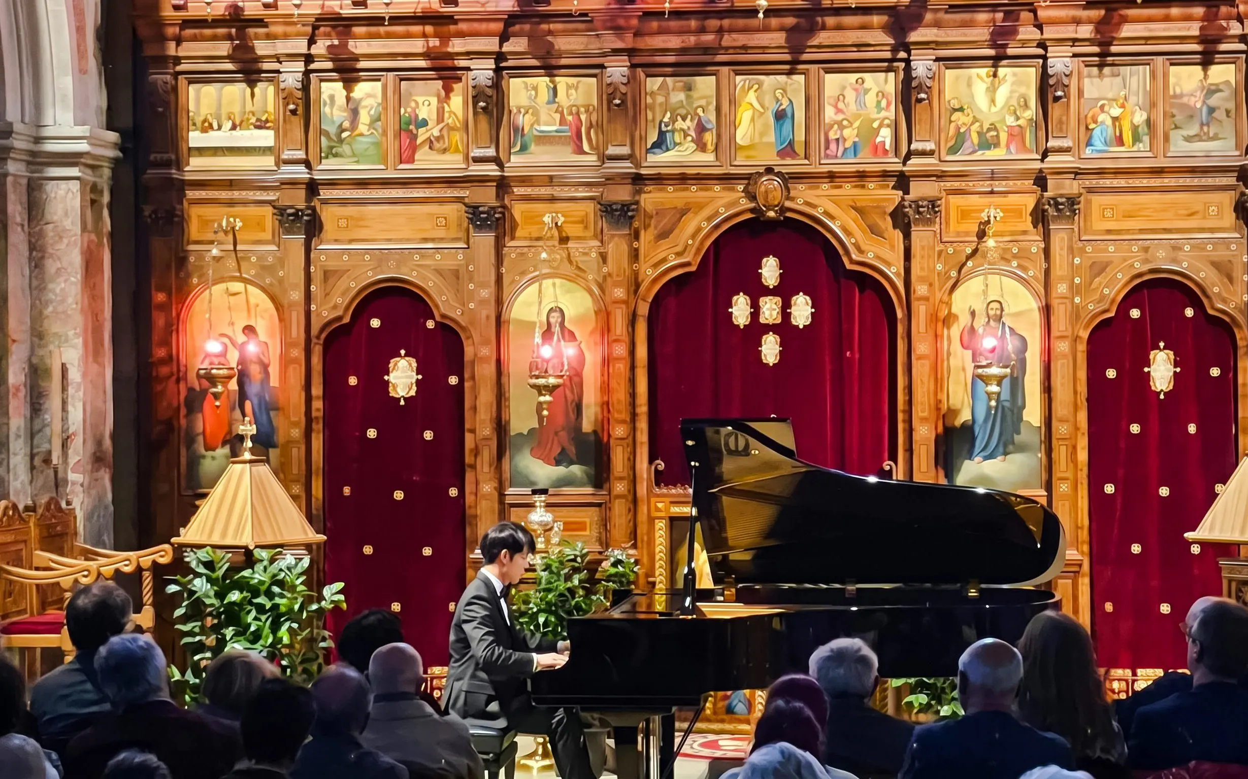 Pianist performing at Chopin Piano Concert in Saint-Julien-le-Pauvre, Paris.