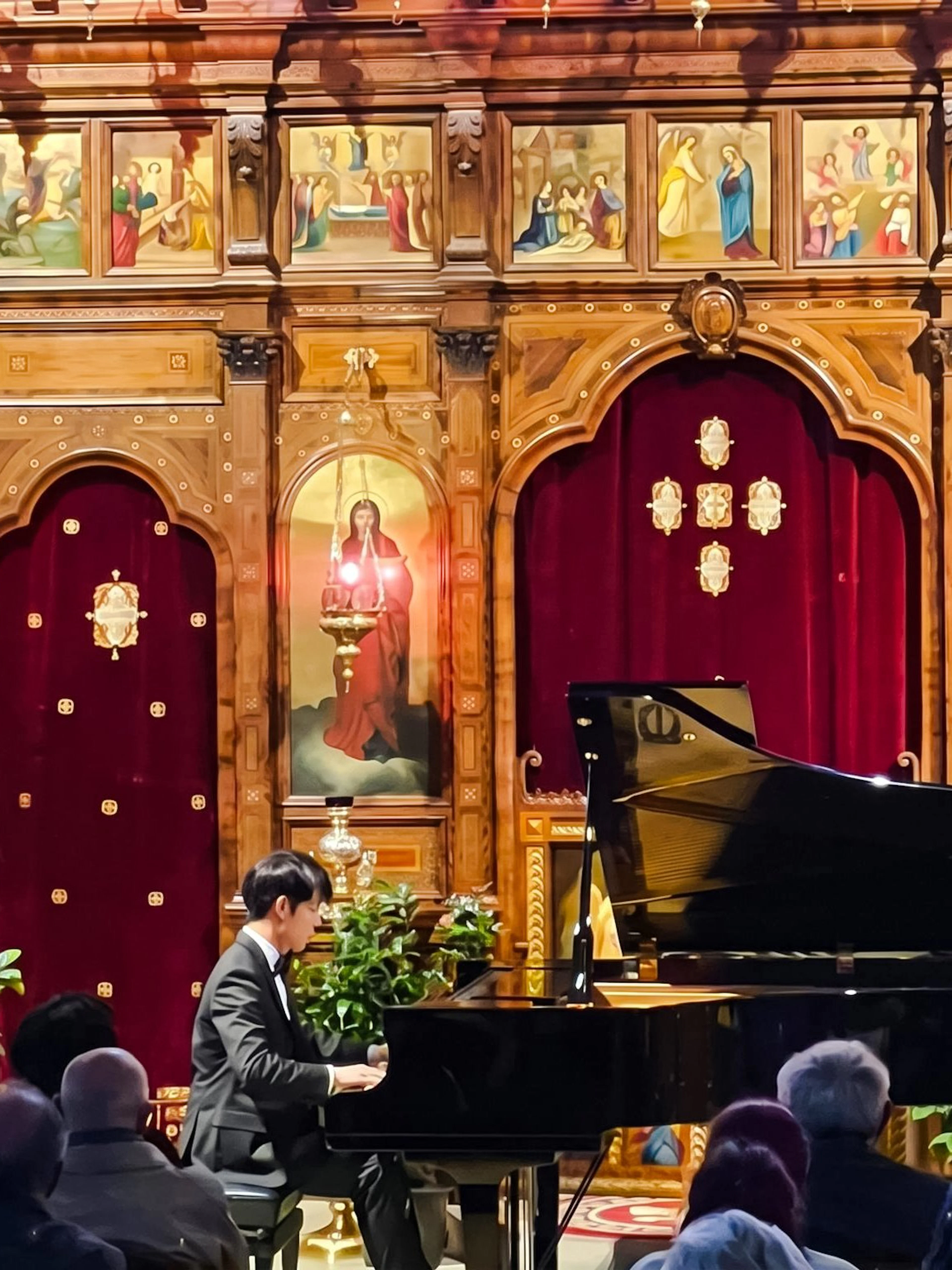 Pianist performing at Chopin Piano Concert in Saint-Julien-le-Pauvre, Paris.
