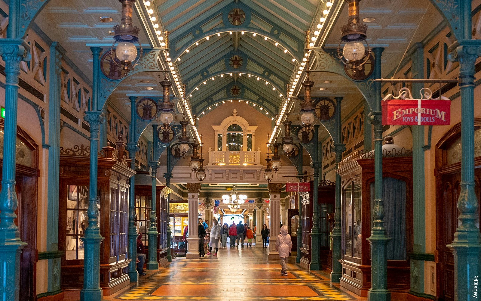 Discovery Arcade at Disneyland Paris with vintage exhibits and architectural details.