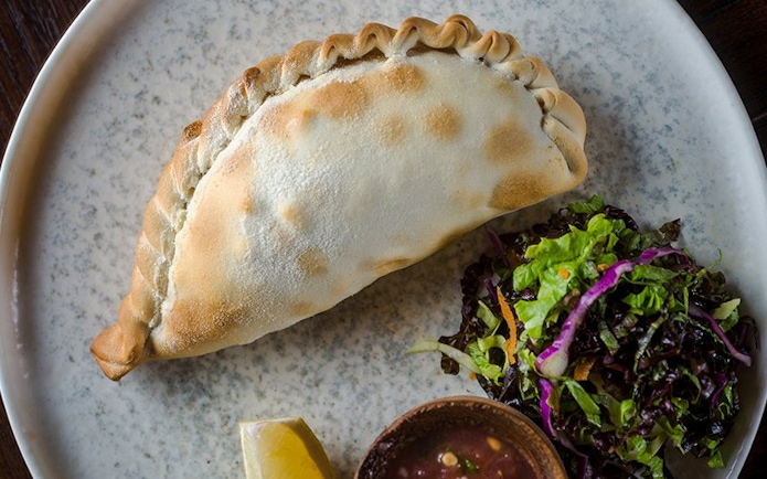 Empanada with salad and sauce at Aljibe Tango Show, Buenos Aires.