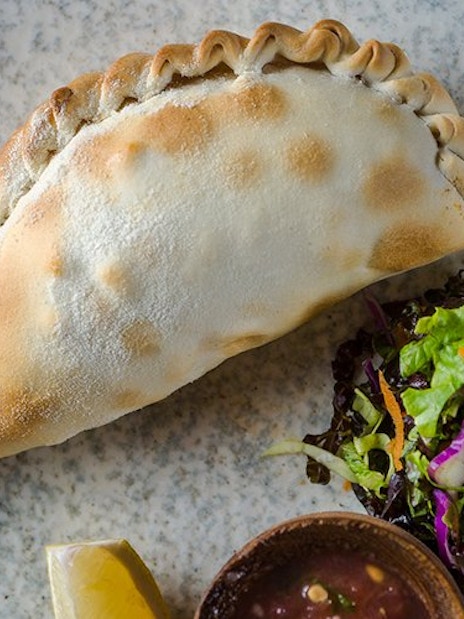 Empanada with salad and sauce at Aljibe Tango Show, Buenos Aires.
