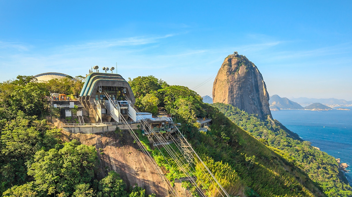 Cable car station at Sugarloaf Mountain, Rio de Janeiro, with passengers boarding.