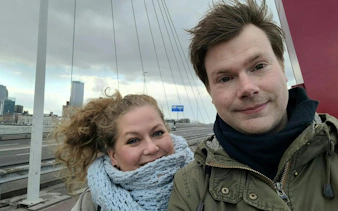 Rotterdam cityscape with Erasmus Bridge in background during self-guided exploration game.