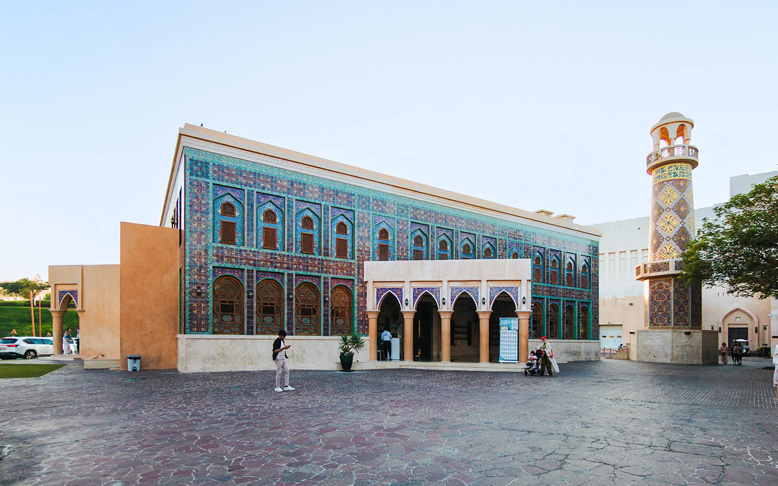 Katara Mosque with intricate tile facade and minaret in Katara Village, Qatar.