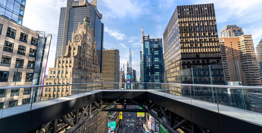 One Times Square Skywalk view of New York City skyscrapers and Times Square below.